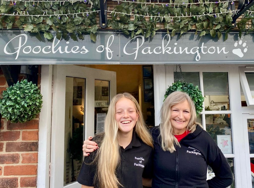 Poochies Front View with Bev Smith at R and Margaret